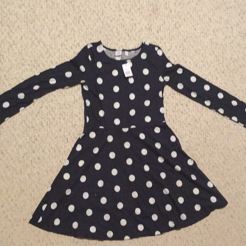 This is a kids black with white spots dress